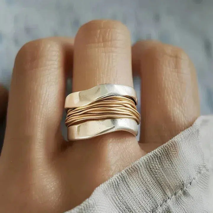 Silver ring woven with golden threads