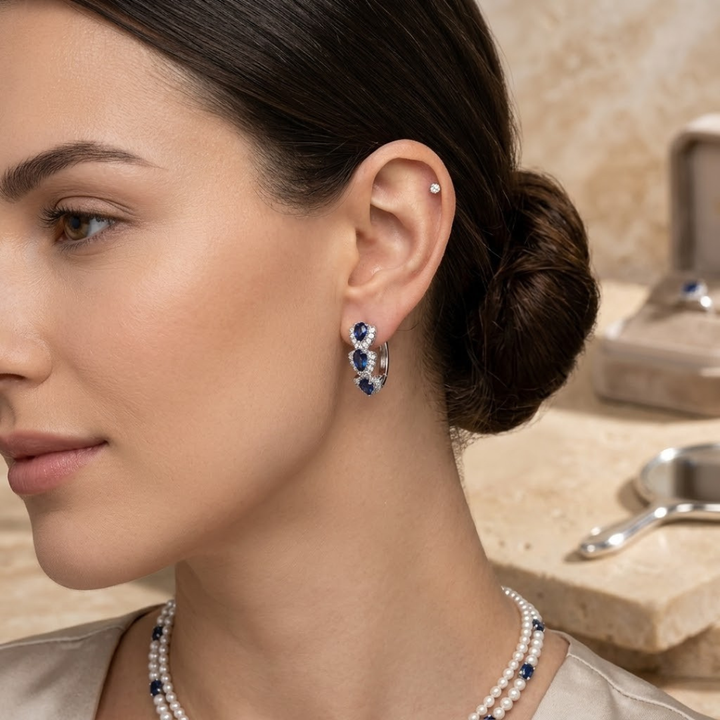 Halo-Designed Silver Hoop Earrings Adorned with Sapphire Stones