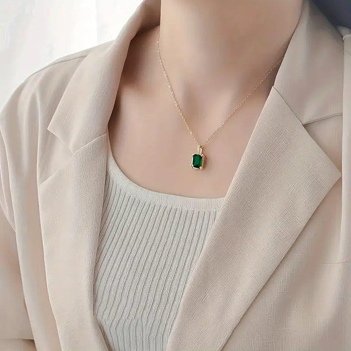 Emerald and Gold Rectangular Halo Pendant Necklace