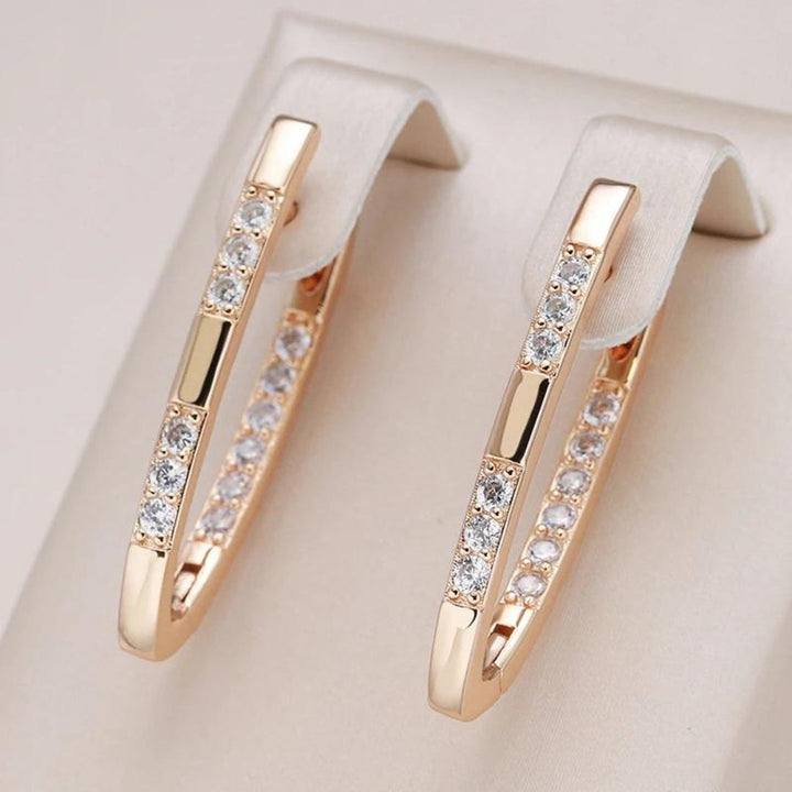 Elegant Gold Earrings Featuring Zirconia Details