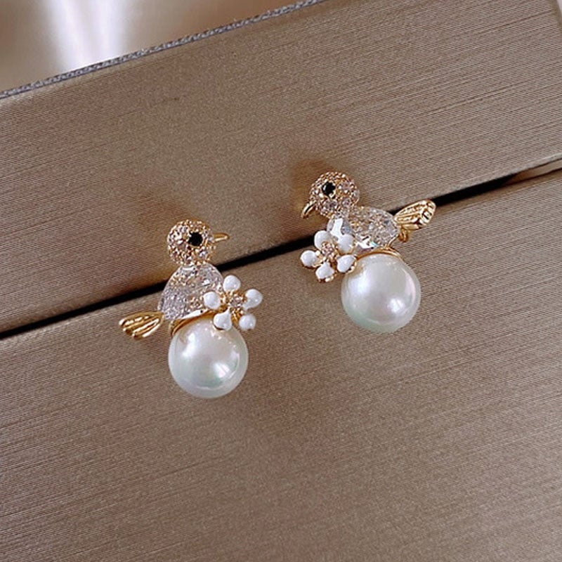 Elegant Birdie Earrings Featuring Cubic Zirconia and Pearl Accents