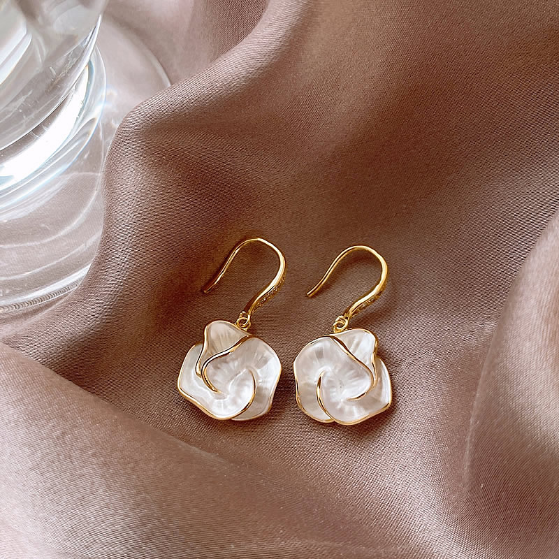 Stylish Earrings Adorned with White Floral Details