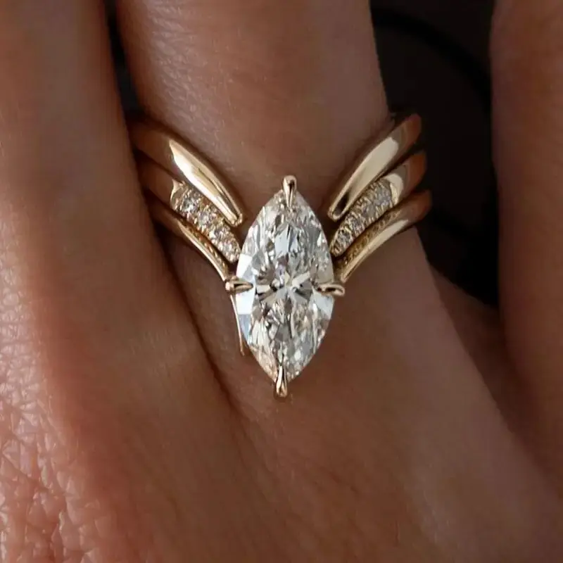 Crown-Inspired Golden Ring with Flowing Drapes