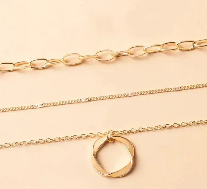 Vintage-inspired gold layered chain necklace with charm