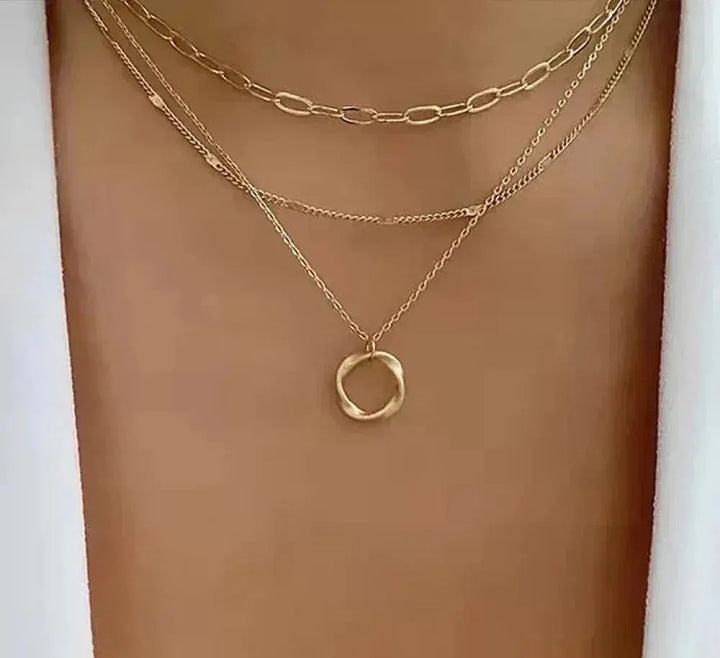 Vintage-inspired gold layered chain necklace with charm