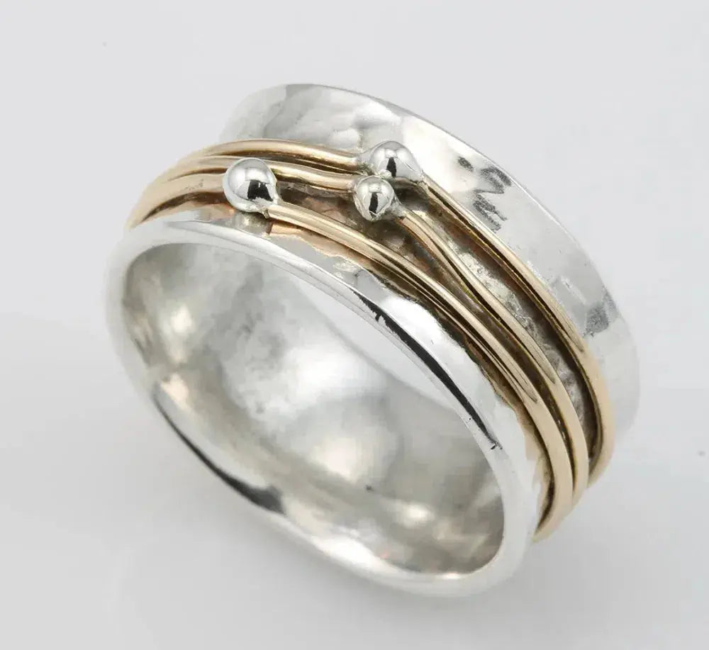 Vintage-style stacked silver ring featuring gold highlights